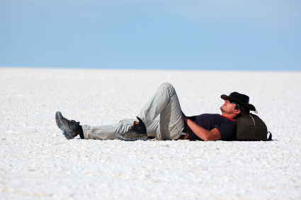 Young man relaxing in salt desert